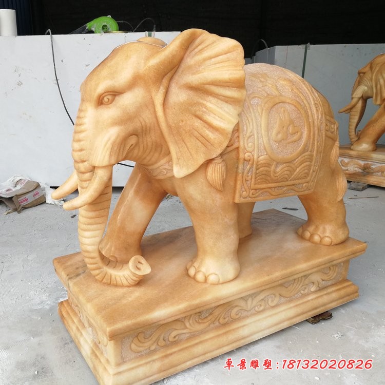 鼻卷如意元宝的大象石雕晚霞红门口镇宅石雕大象 