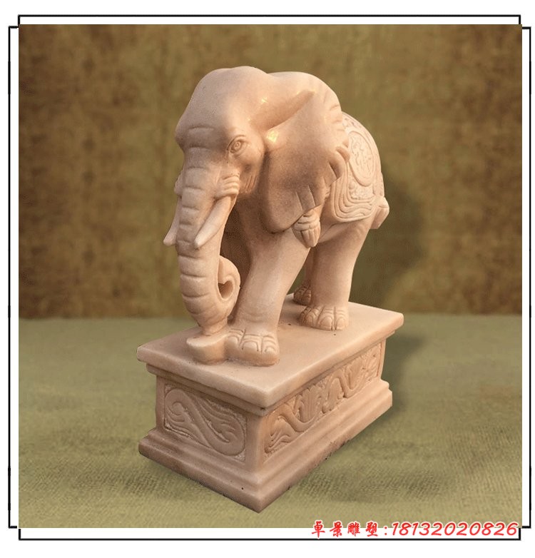 晚霞红招财大象石雕鼻卷元宝的大象石雕