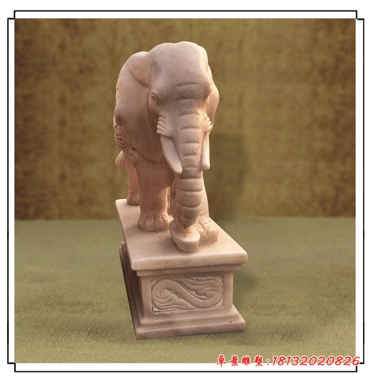 晚霞红招财大象石雕鼻卷元宝的大象石雕
