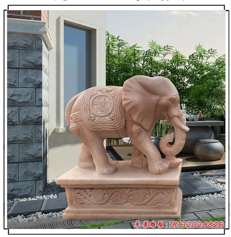 晚霞红招财大象石雕鼻卷元宝的大象石雕 