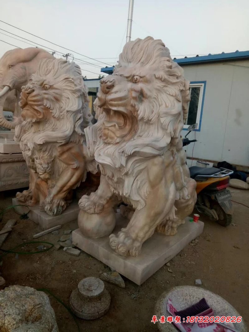 晚霞红欧式踩球石狮子