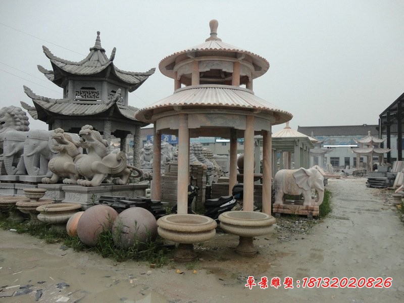 晚霞红圆顶石凉亭海边景观石雕