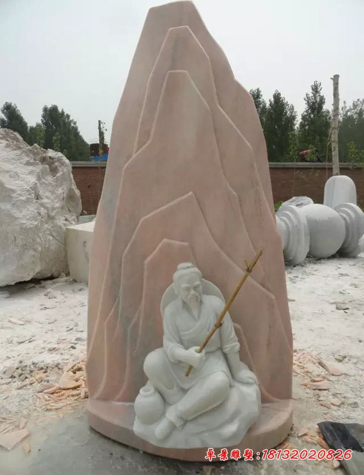 背靠假山的姜太公钓鱼石雕  公园景观石雕