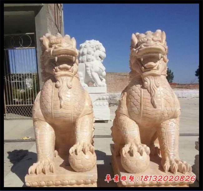 石雕麒麟晚霞红门口踩球麒麟雕塑