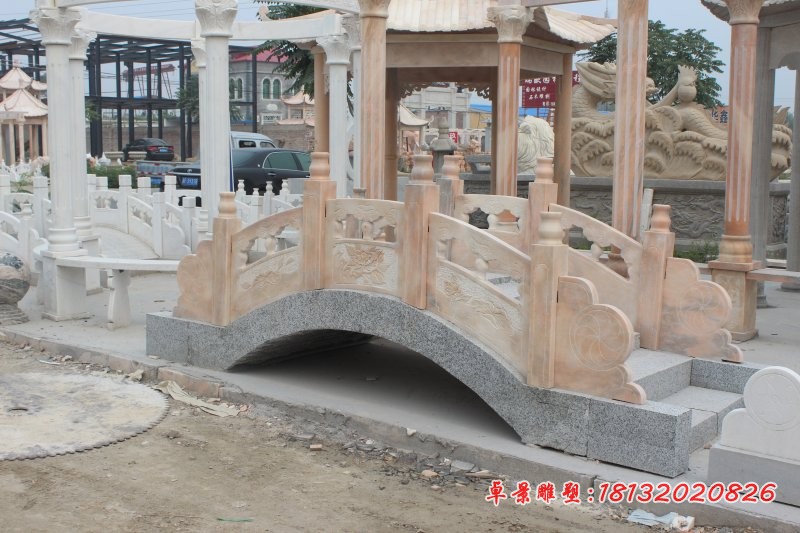 公园石雕拱桥晚霞红石桥雕塑 