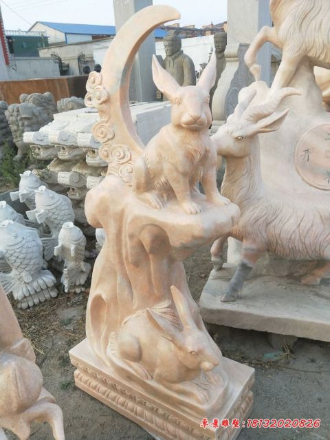 公园动物晚霞红兔子石雕