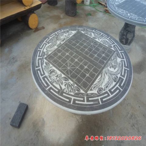 青石棋盘浮雕石桌凳