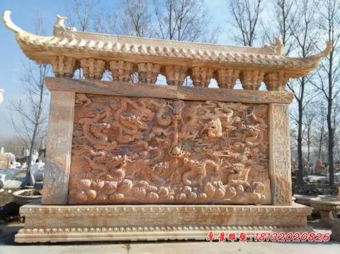 公园晚霞红九龙壁石雕