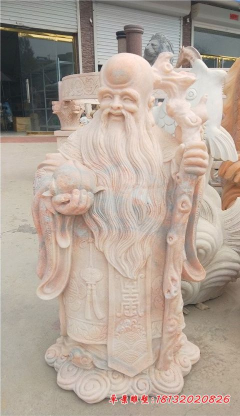 景区晚霞红老寿星石雕