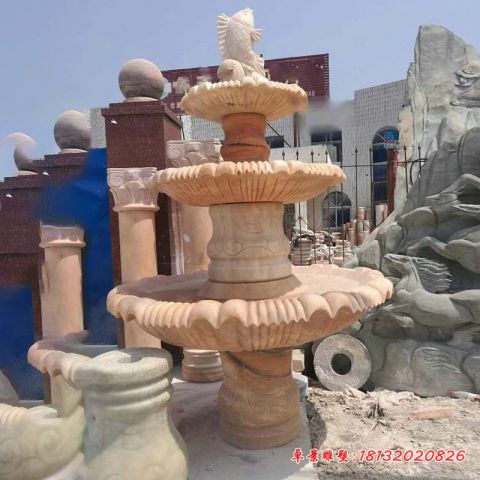 公园晚霞红鲤鱼喷泉石雕